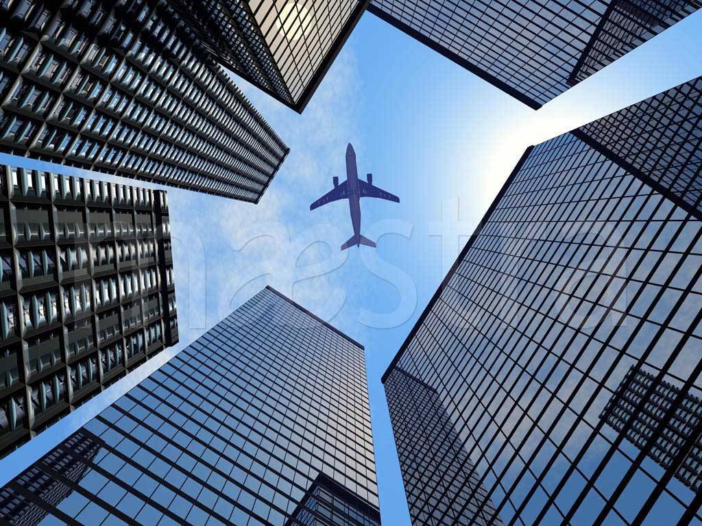 Фотообои Самолет в синем небе и мегаполис